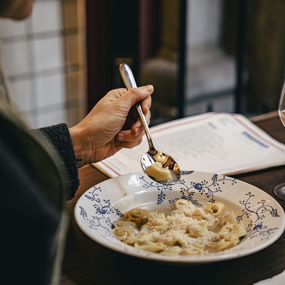 Gazzosa Woman Eating italian cheese pasta